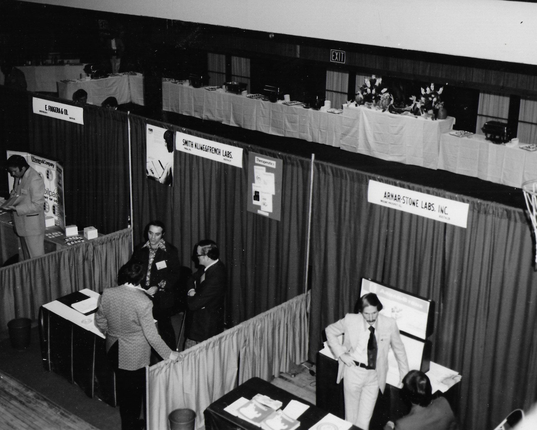 Several exhibit booths seen from above at an angle