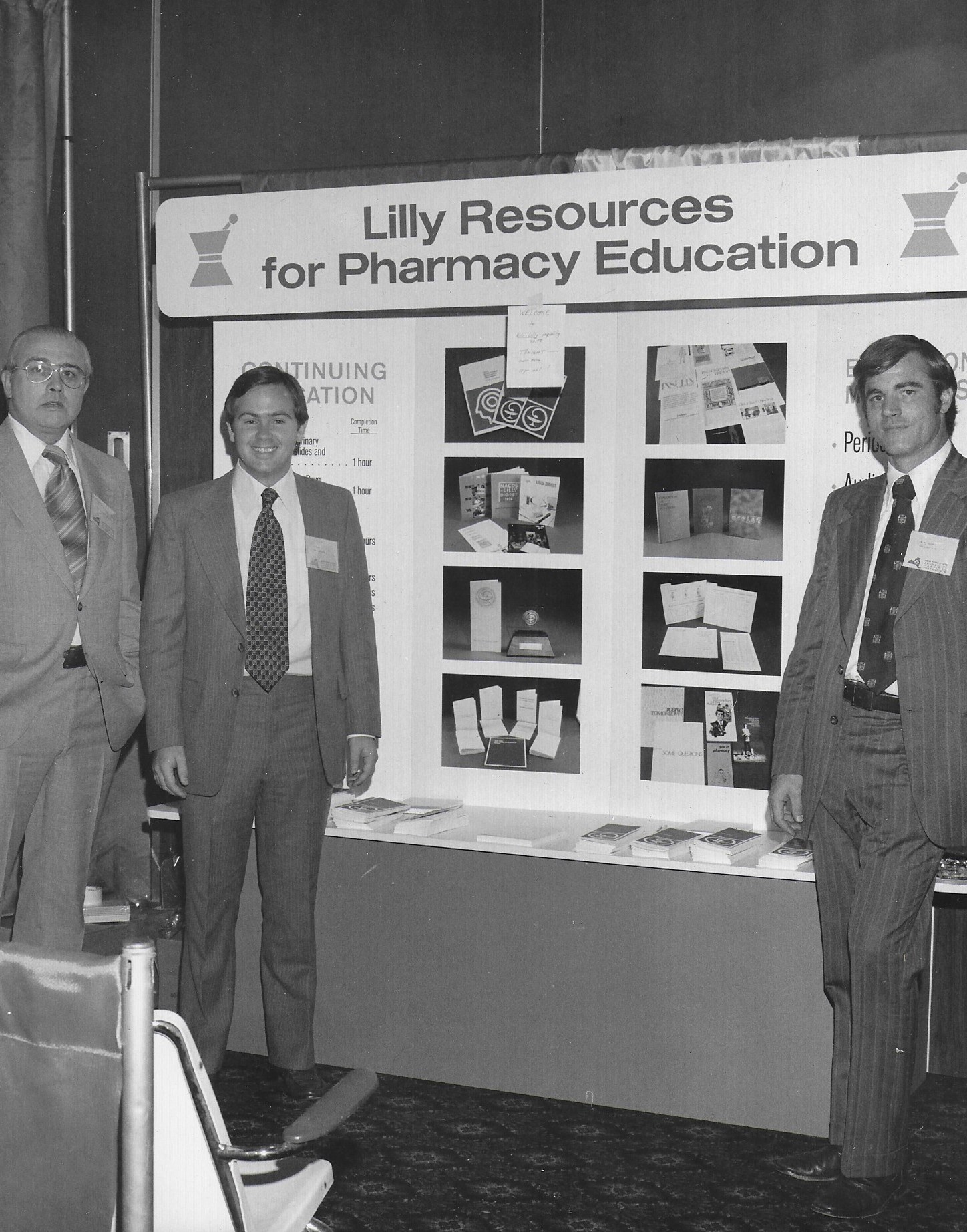 Confernece Goers Smiling for a Photo on the Exhibit Floor