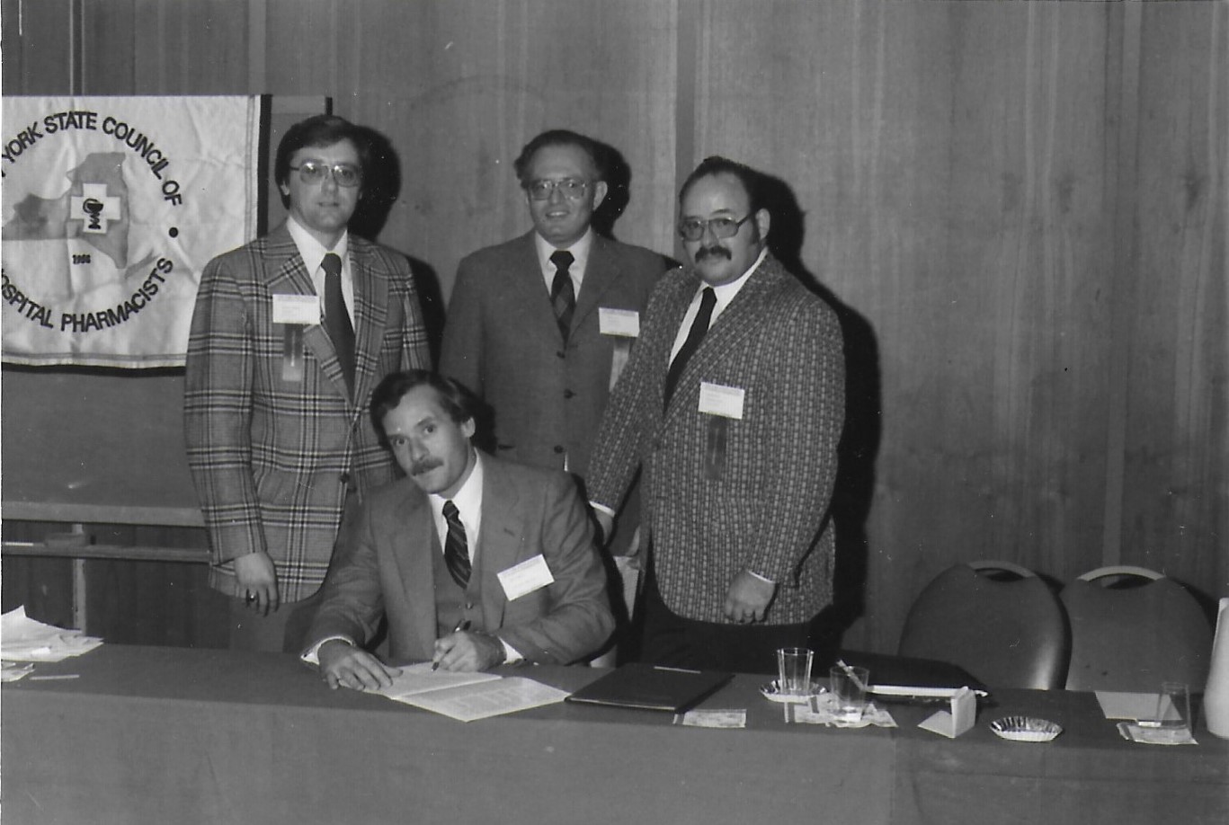B Johnson, M kew, S Katz and D Howard at a Table