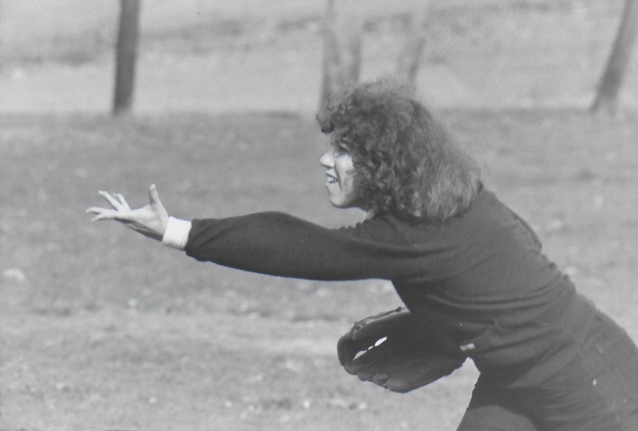 A woman playing in the annual softball game