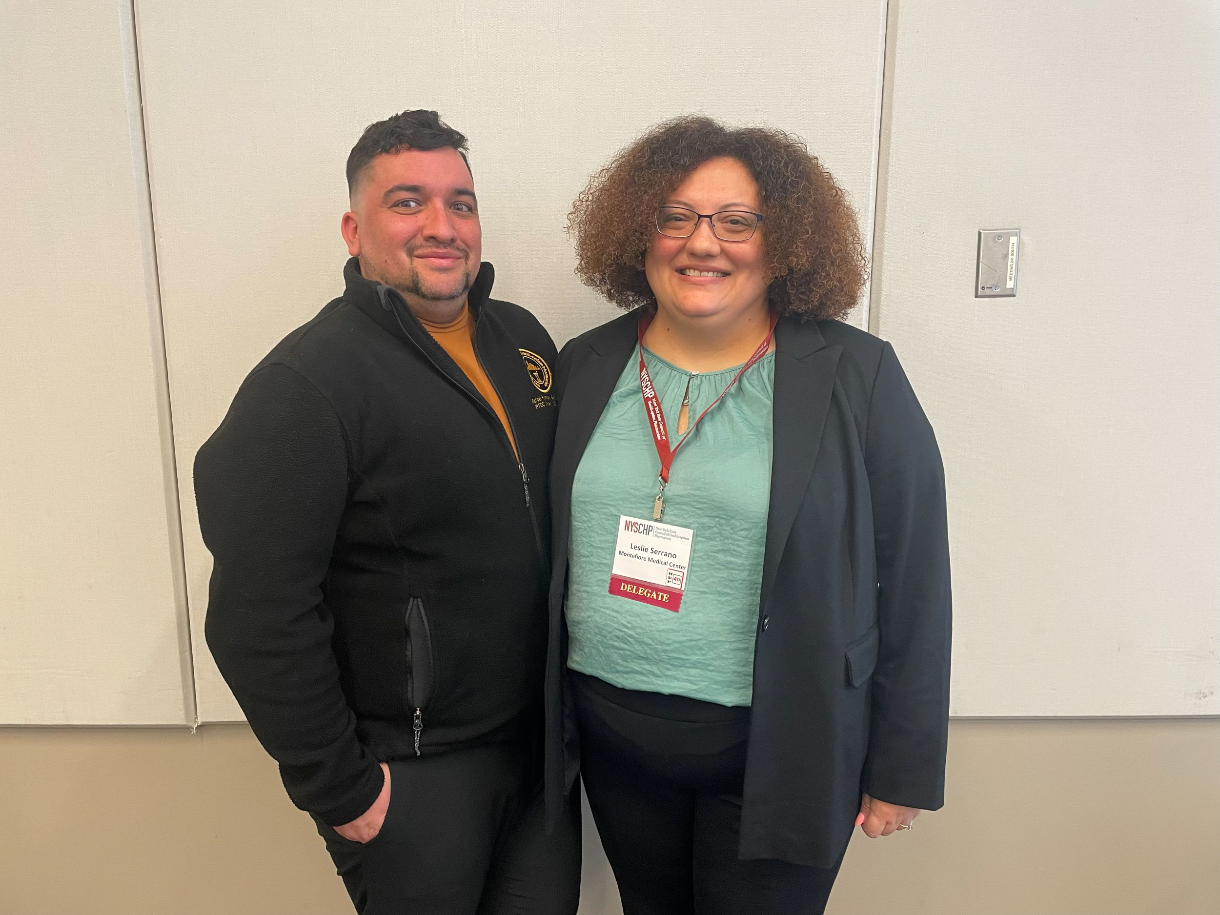 Two members of the Technician delegation pose side by side